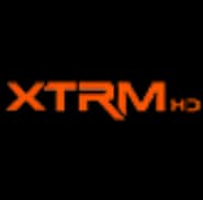 Logo de XTRM en color naranja sobre fondo negro